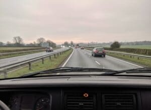 AdBlue warning light visible from the driver's perspective on a dual carriageway